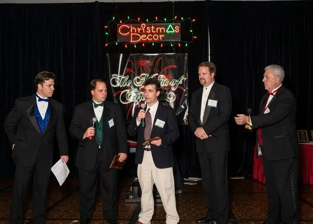 Dave Dolak on stage receiving an industry award